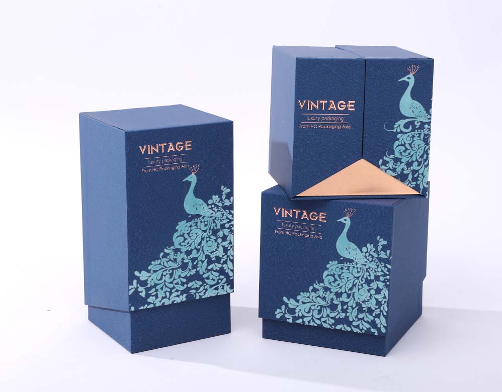 Upright blue perfume cartons with matching artwork